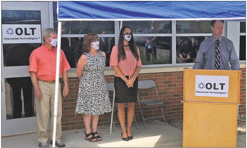 State Rep. Mark Longietti speaks Friday during ribbon-cutting ceremonies for OhanaLink Technologies. Next to him are, from left OhanaLink Chief Technical Officer Thomas McKinley, OhanaLink Chief Financial Officer Janet Earle and OhanaLink founder an…